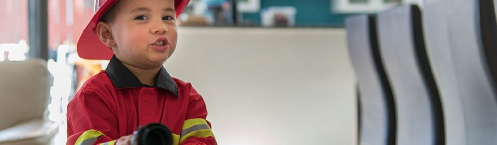 boy dressed up as a fireman